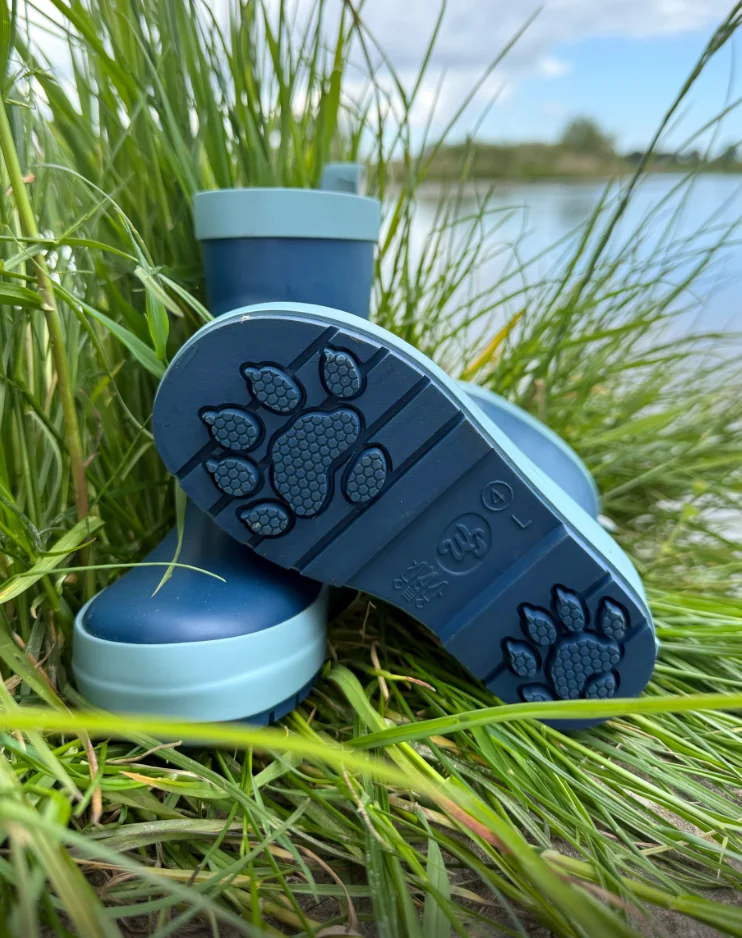 Mud the otter blue WelliePaws boots showing the otter paw-print sole